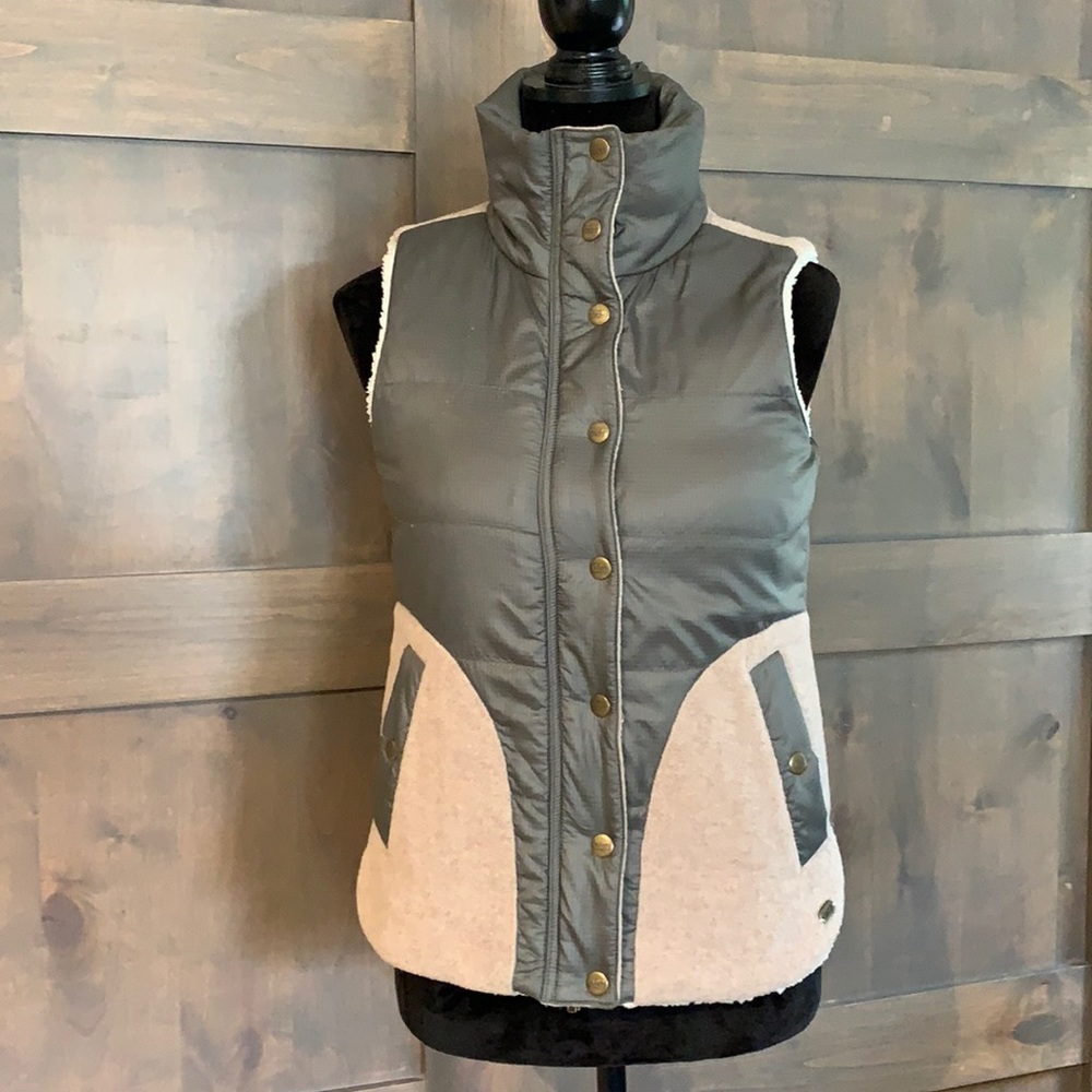 Carve design, olive, tan, and ivory vest.
